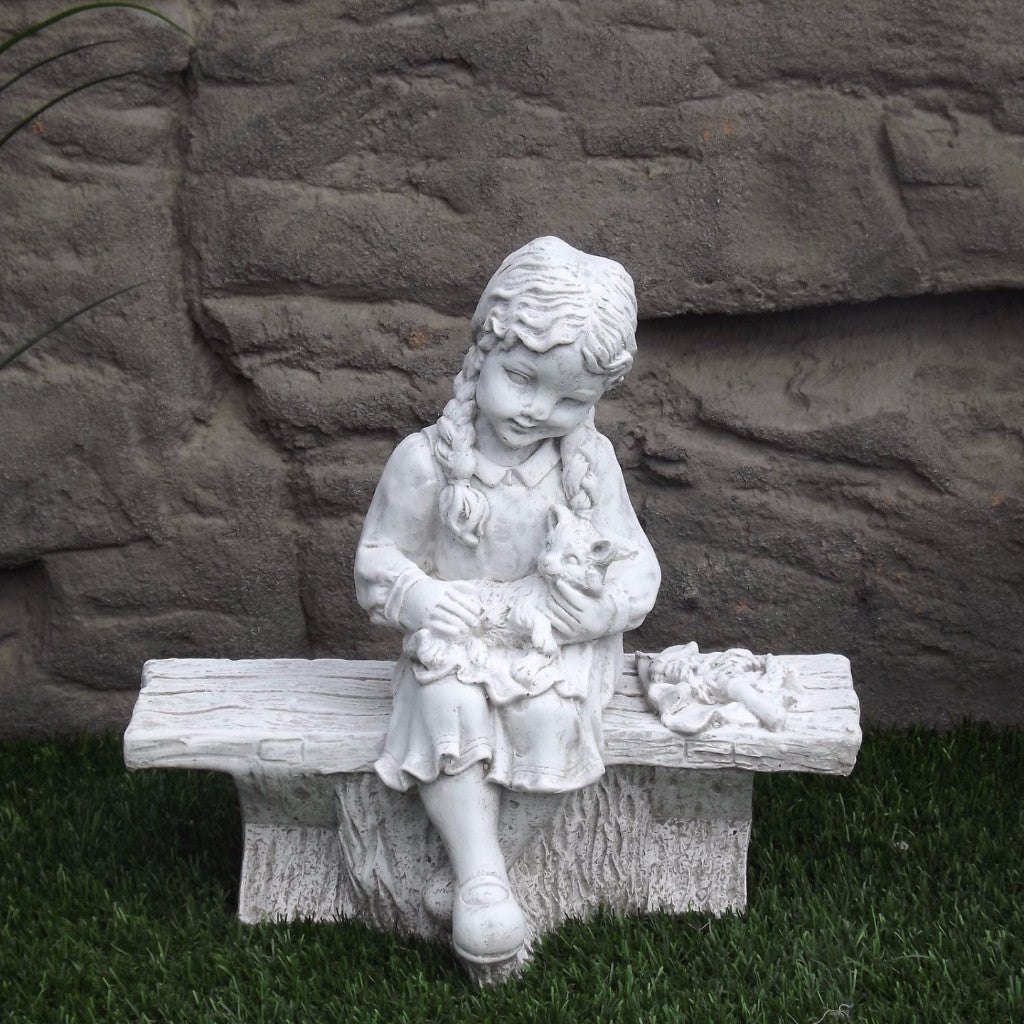 Photo of Small Girl on Bench with Cat - Marquis Gardens