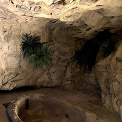 Interior Room with in ground, faux stone hot tub. The Wall Behind is covered by the Basalt Wall Panel and Faux Ferns