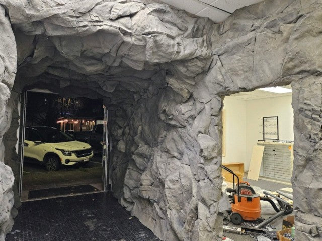 Interior Hallway with Open door leading to street. Basalt Panel is covering wall and ceiling, with cutout for side doorway