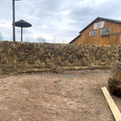 Large Outdoor Stone Barrier on Farm covered with Cavern Wall Panels