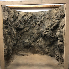 Square, Wooden Doorway with Cavern Wall Panel Covering Interior Wall, Wrapping in a Semi-Circle Pattern