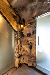 Malawi Panel mounted on corner wall of sauna, between a large frosted door and frosted glass pane